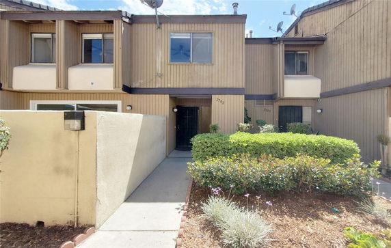 Front view of a two-story townhouse with a central entrance.