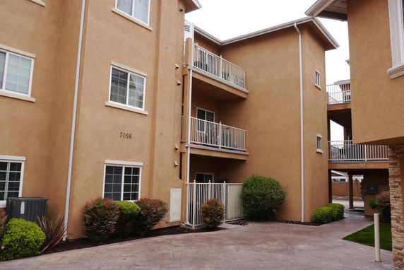 Front view of an apartment building with balconies.