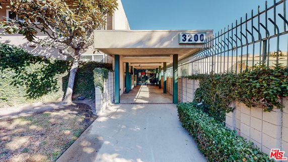 Front view of a building entrance with address number 3200.