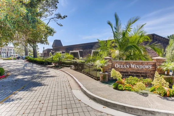 Front view of a residential building with a sign reading 'Ocean Windows'.