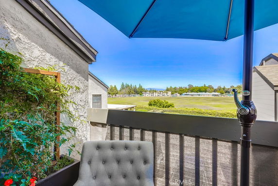 Outdoor view from a balcony with surrounding area visible.