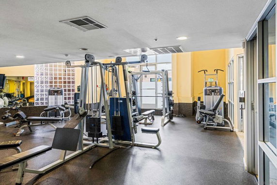 Indoor gym area with various exercise equipment.