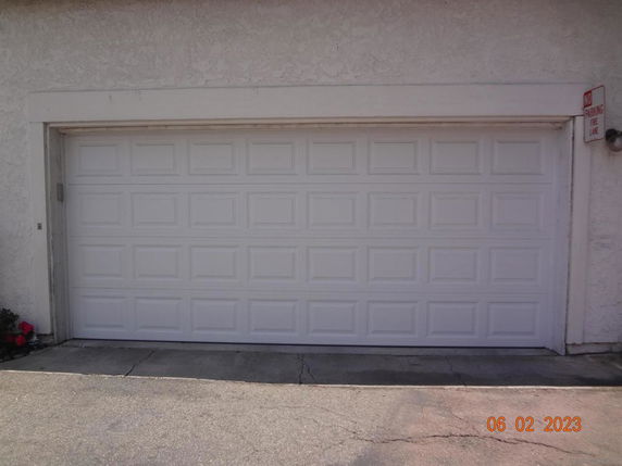 Front view of a garage door on a building.