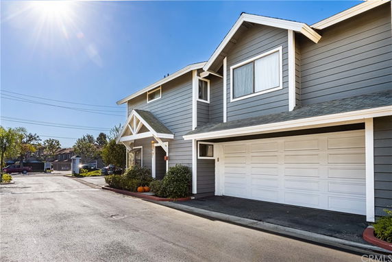 Front view of a two-story house with a double garage.