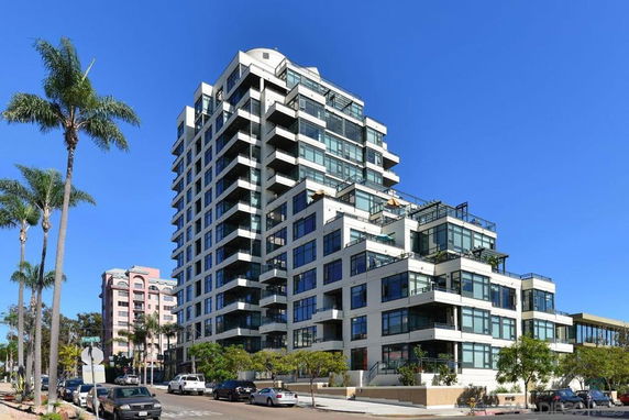 Front view of a modern multi-story apartment building.
