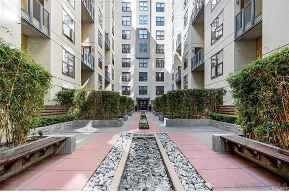 Courtyard view of a multi-story apartment building.