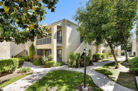 Front view of a two-story residential building with balconies
