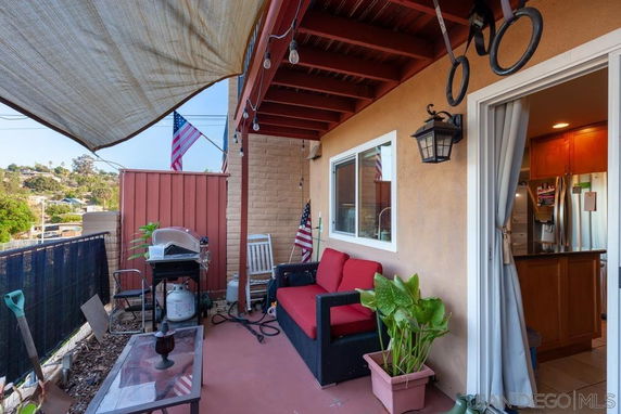 Outdoor patio area with seating and a view of the surrounding area.