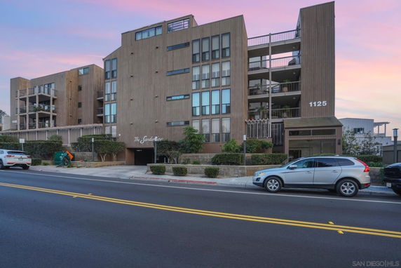 Front view of a multi-story building with a modern design.