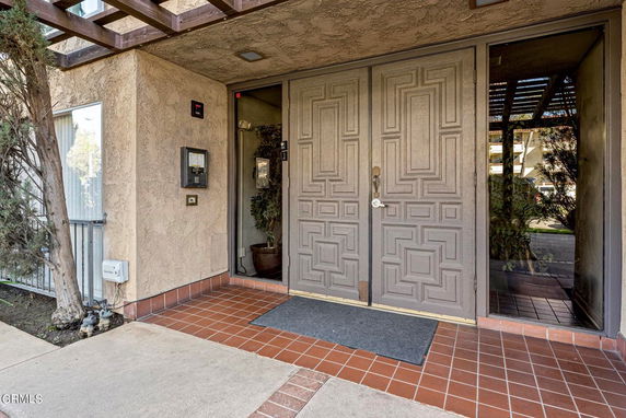 Front view of a building entrance with double doors.