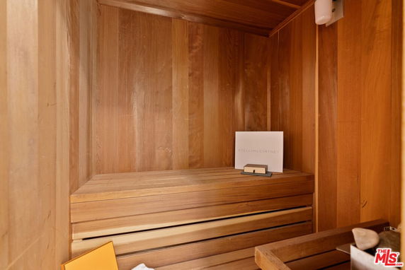 Interior of a wooden sauna room with bench seating.