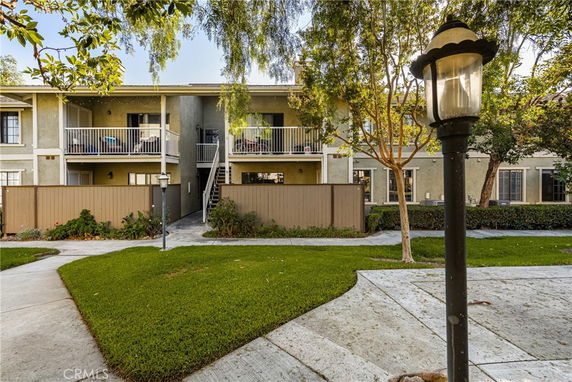 Front view of a two-story residential building with balconies.