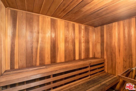 Wooden sauna room interior with benches.