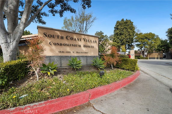 Front view of the entrance sign for South Coast Villas Condominium Homes.