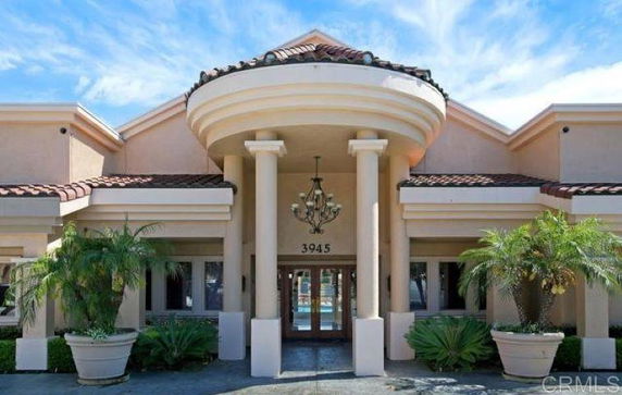 Front view of a building with a prominent entrance and columns.