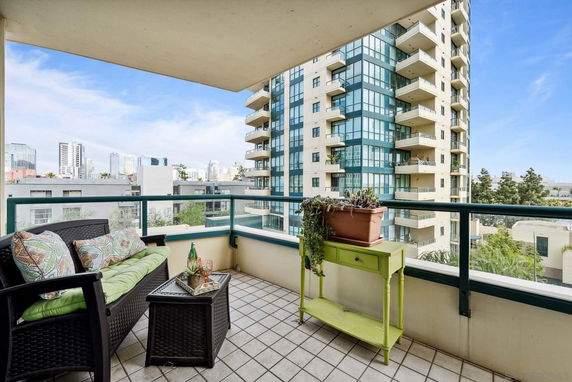 Balcony view overlooking surrounding buildings in an urban area.