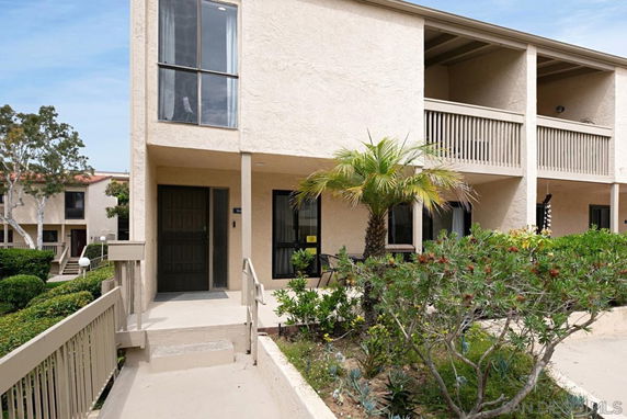 Front view of a two-story residential building with balconies.