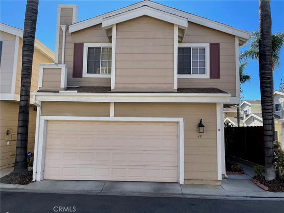 Front view of a two-story house with a double garage.