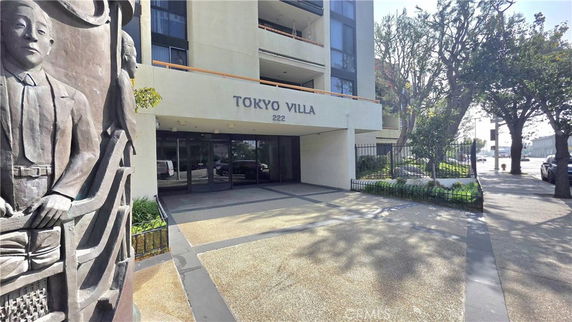 Front view of a multi-story building named Tokyo Villa.