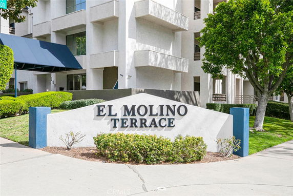 Front view of a building with the sign 'El Molino Terrace'.