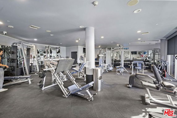 Interior of a gym with various fitness equipment and exercise machines.