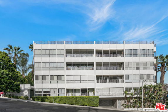 Front view of a multi-story residential building with a modern design.