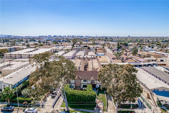 Aerial view of a residential area with multiple buildings and trees.