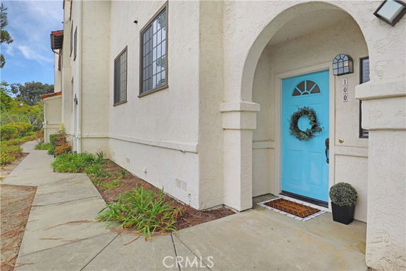 Entrance view of a house with a light blue door