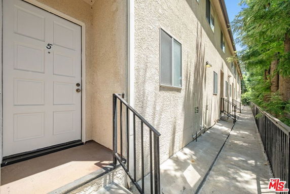 Exterior view of a building with multiple doors and windows.