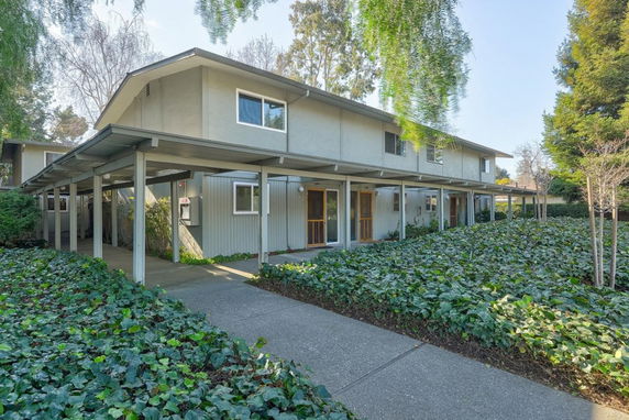 Front view of a two-story building with a covered walkway.