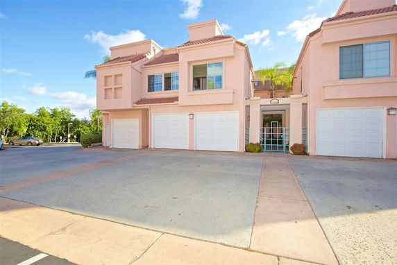 Front view of a townhouse with attached garages.