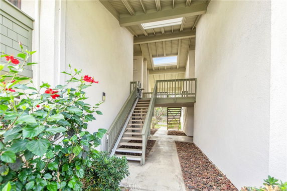 View of an exterior staircase and entryway of a building.