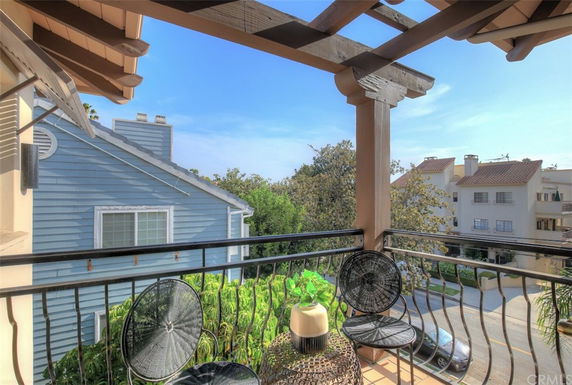 View from a balcony overlooking surrounding residential buildings.