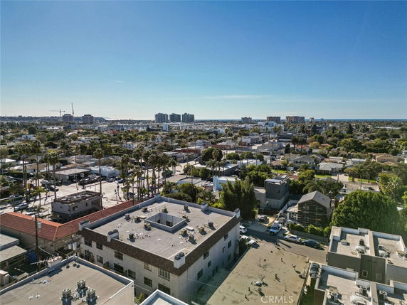 Panoramic view of a cityscape with multiple buildings and a clear sky.