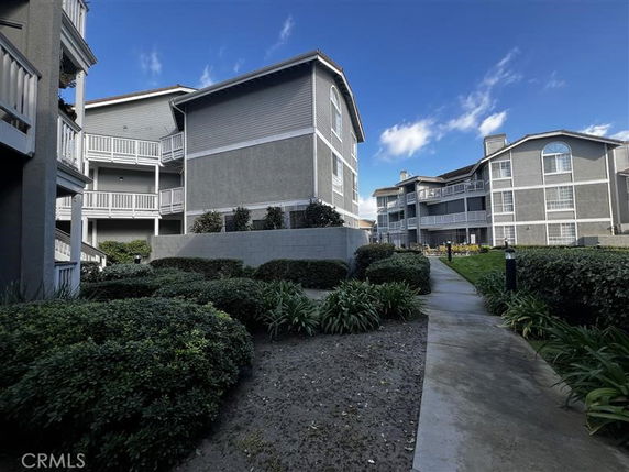 Front view of multi-story residential buildings with balconies.