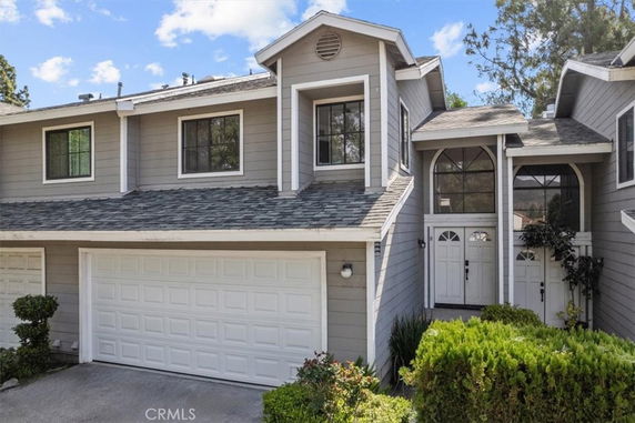 Front view of a two-story house with an attached garage.