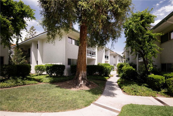 Front view of a multi-story residential building with balconies.