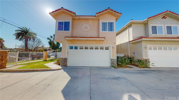 Front view of a two-story house with a double garage.
