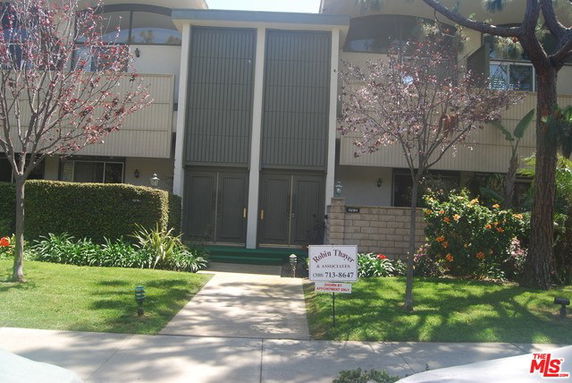 Front view of a two-story residential building with balconies.