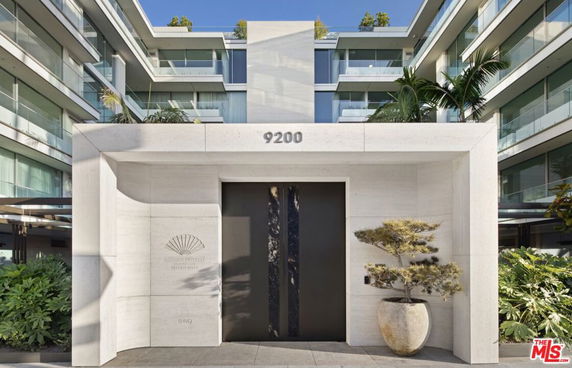 Front view of a modern multi-story building entrance.