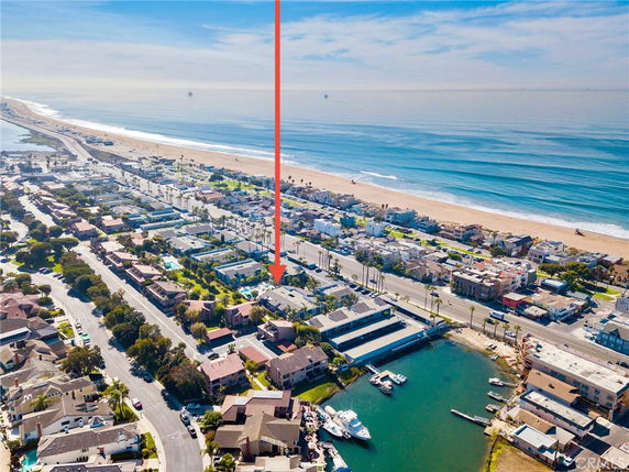 Panoramic view of a coastal residential area with the ocean in the background.