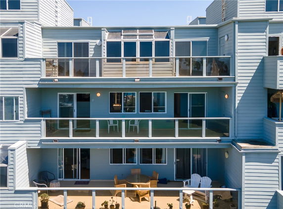 Front view of a multi-story building with balconies.