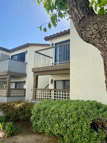 Front view of a two-story building with balconies.