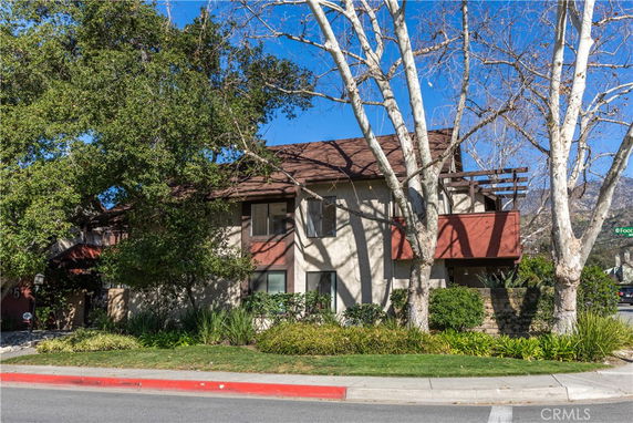 Front view of a two-story house with a balcony