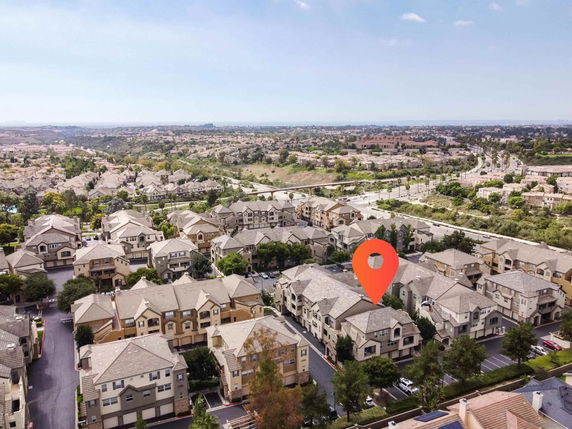 Aerial view of a residential neighborhood with multiple houses and roads.