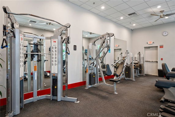 Indoor gym area with various exercise machines and equipment.