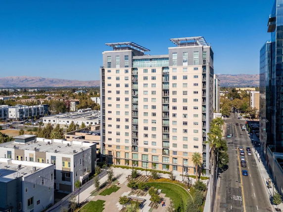 Front view of a multi-story residential building with a modern design.
