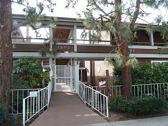 Front view of a two-story building with a ramp entry.