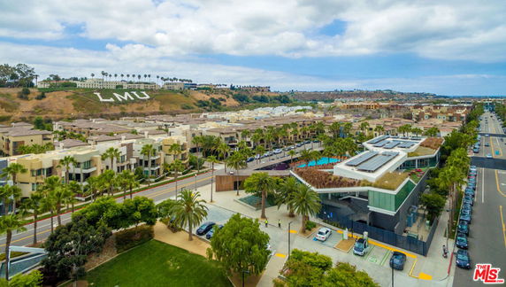 Panoramic view of residential area and buildings from a high vantage point.