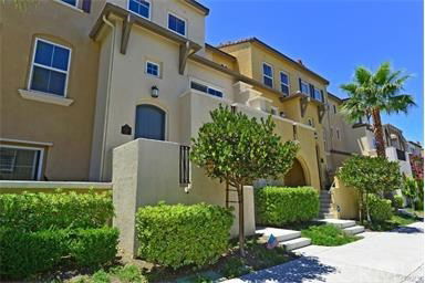 Front view of a multi-story residential building with beige exterior.